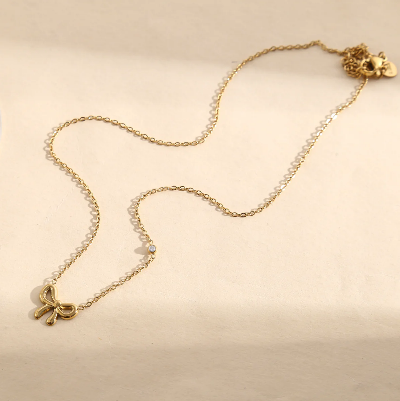 Collier Petit Nœud - Doré