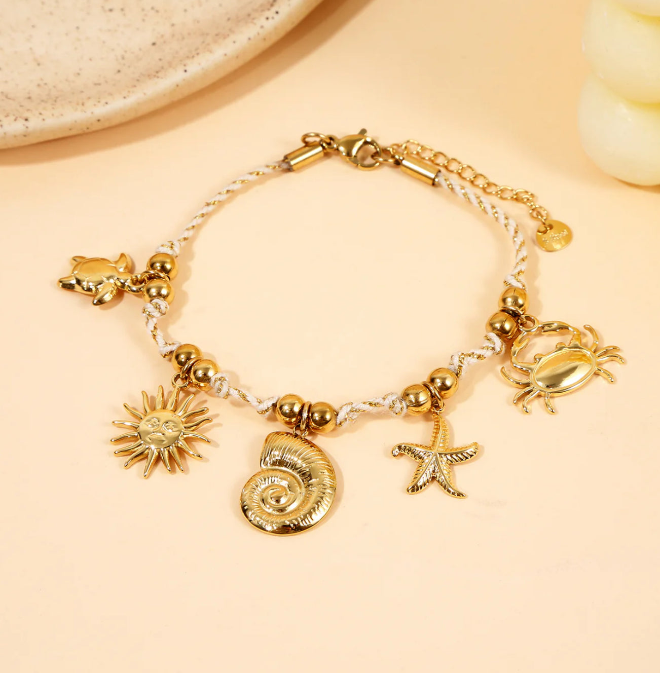 Bracelet tressé doré Charms marins dorés