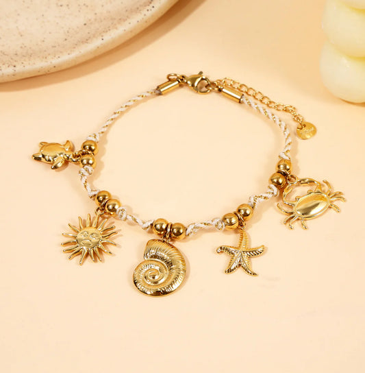 Bracelet tressé doré Charms marins dorés